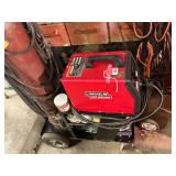 Lincoln wire welder Model 170-T with cart and regulator, hose and tank for MIG welding, several rolls of solid wire and flux wire, 220 volt, uses a double pole 20 amp breaker. Also has 25 ft. extra 10