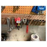 5 new 8 inch adjustable wrenches, 6 adjustable 6 inch wrenches, 1 Craftsman stud remover, 5 piece set of 8 point sockets with 1/2 inch drive for square nuts