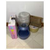 Pet Accessory Assortment Including Upsky Roller Cat Toy, R.R.P. Co. Crock, and Photo Frame