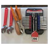1 new Hyper tough ¼ inch socket set, 2 - 8 inch adjustable wrenches, 1 new high capacity pliers w/ pouch
