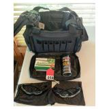 New real nice Range Bag, with lots of compartments, 1 new can of Break Free, 2 pair of Winchester shooting glasses, and 1 box of 100 FMJ-9MM ammo.