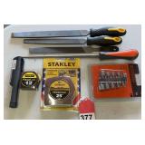 2 new Stanley tapes, Black and Decker nut driver set, and a new 4 piece file set.