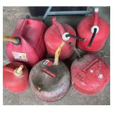6 various sizes of gas cans