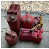 6 used gas cans in different sizes