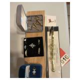 7 various rings, 3 tie clips, cufflinks, flag pin and bracelet buddy