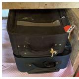 2 real nice carry on suitcases, with handles and wheels