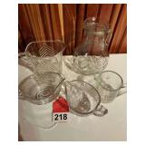5 glass cream pitchers, the large one has a sailing ship on both sides