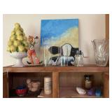 Faux eggs, candles, clear vase, and other decor