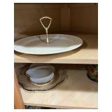 Four shelves of assorted kitchen glassware