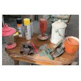Hummingbird feeder with miscellaneous hand, tools, and cowbell