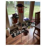 Metal plant stand with artificial violets