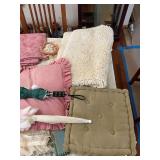 Rug, umbrellas, pillows, and photo album