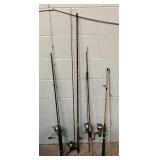 Four Fishing Poles & Reels