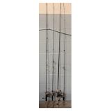 Four Fishing Poles & Reels
