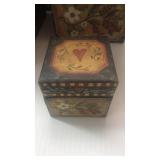 7 stacking boxes. 43" hi. 9" sq down to 3.25".