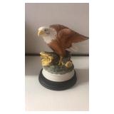 The American Bald Eagle figurine with wood base.