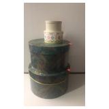 4 stacked round boxes. 18"hi x 11" down to 4"