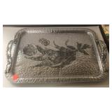 Tray. Hammered metal with embossed design.