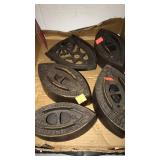 4 sad irons & resting plate.  Griswald