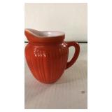 Orange cream pitcher.  1940