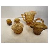Five pieces of amber glass decoratives