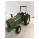 John Deere toy tractor.  Missing tire.