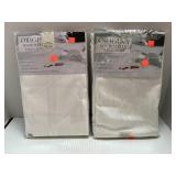 2 Cream Colored Oval Microfiber Tablecloths 60x84