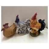 3 chickens / roosters.  Cloth. Ceramic. Resin.