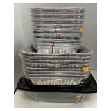 Lot of disposable baking pans with lids.