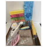 Lot of cleaning supplies. Dusters. Sponges. Etc.