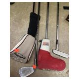 Lot of 4 golf clubs.