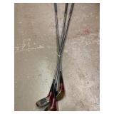 3 Wilson Golf Clubs.