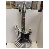 Guitar Clock w/ Neon (?) light. Needs batteries.