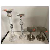 Four candlesticks. 1 pair.  2 coordinate.
