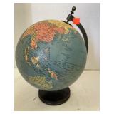 Old globe on stand. 12in high. Has tear.