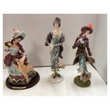 3 lady figurines.