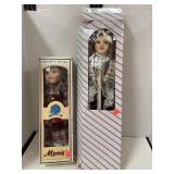 2 porcelain dolls. One is Menie. 16in & 20in tall