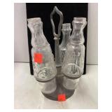 Cruet set in holder.  Some chips.