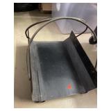 Metal fireplace wood holder.