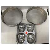 2 spring form pans & skull cupcake pan.