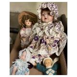 Lot of 4 dolls.  3 with porcelain faces.