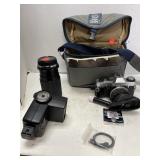 Olympus camera, lens, flash in bag.