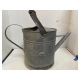 Galvanized watering can.