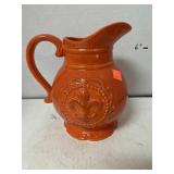 Orange Ceramic Pitcher. Approximately 8 in Tall