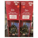 2 - 24in pre-lit Christmas Trees.