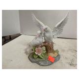 Porcelain bird figurine.