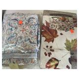 2 tablecloths. Vinyl & fabric.