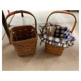 2 Longaberger baskets. One with cloth liner.