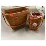 2 Longaberger baskets 1 w/ cloth & plastic liner