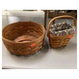 2 Longaberger baskets. Small basket has cloth &